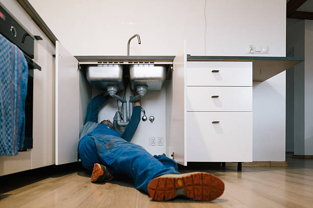 Professional Emergency Plumber technician working in Hampton Bays, NY